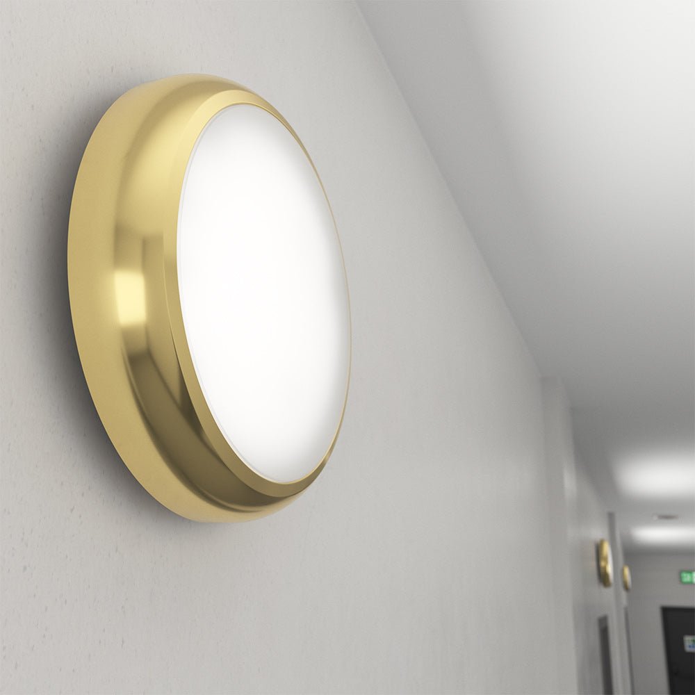 EUSTON TRINITY Slim Bulkhead Light | LED Multi Wattage 2160lm | Tri - Colour CCT | IP65 | Brass | 3hr Emergency - LightHub Direct