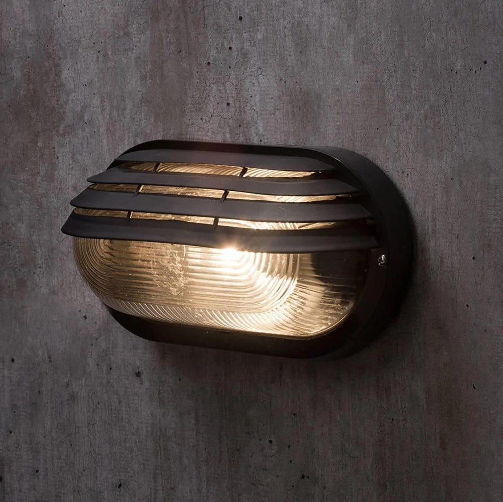 PUCK | Oval Bulkhead Outdoor Glass Wall Light Fitting | E27 | IP44 | Black Caged - LightHub Direct