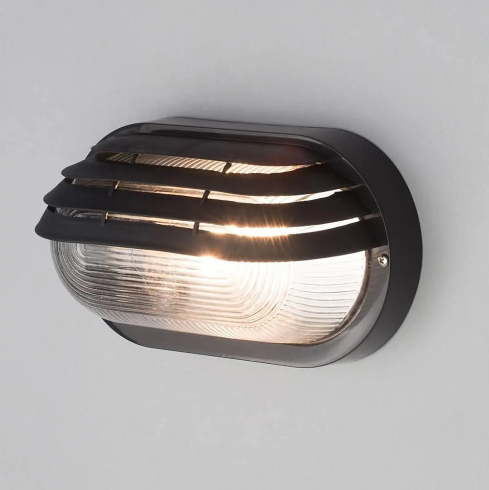 PUCK | Oval Bulkhead Outdoor Glass Wall Light Fitting | E27 | IP44 | Black Caged