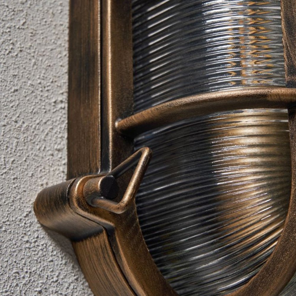 DAVEY | Outdoor Caged Oval Industrial Marine Nautical Wall Porch Bulkhead Light | E27 | IP44 | Gold - LightHub Direct