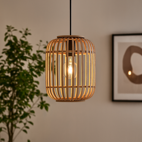 Bamboo pendant light hanging in a room with a plant and wall art.