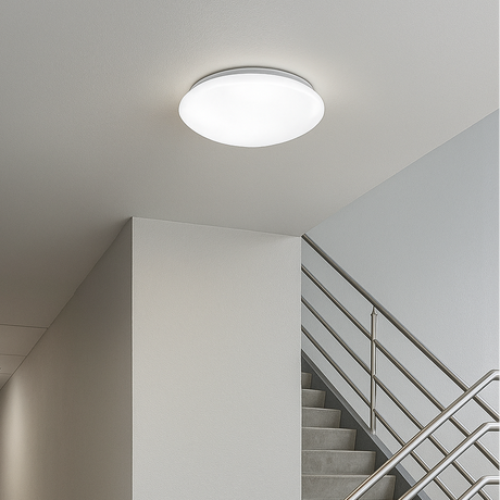 Ceiling light fixture in a stairwell with a neutral color scheme