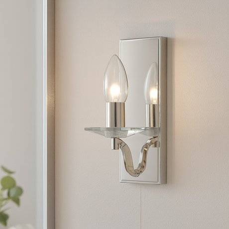 Wall-mounted mirror with a decorative light fixture in a bathroom setting.