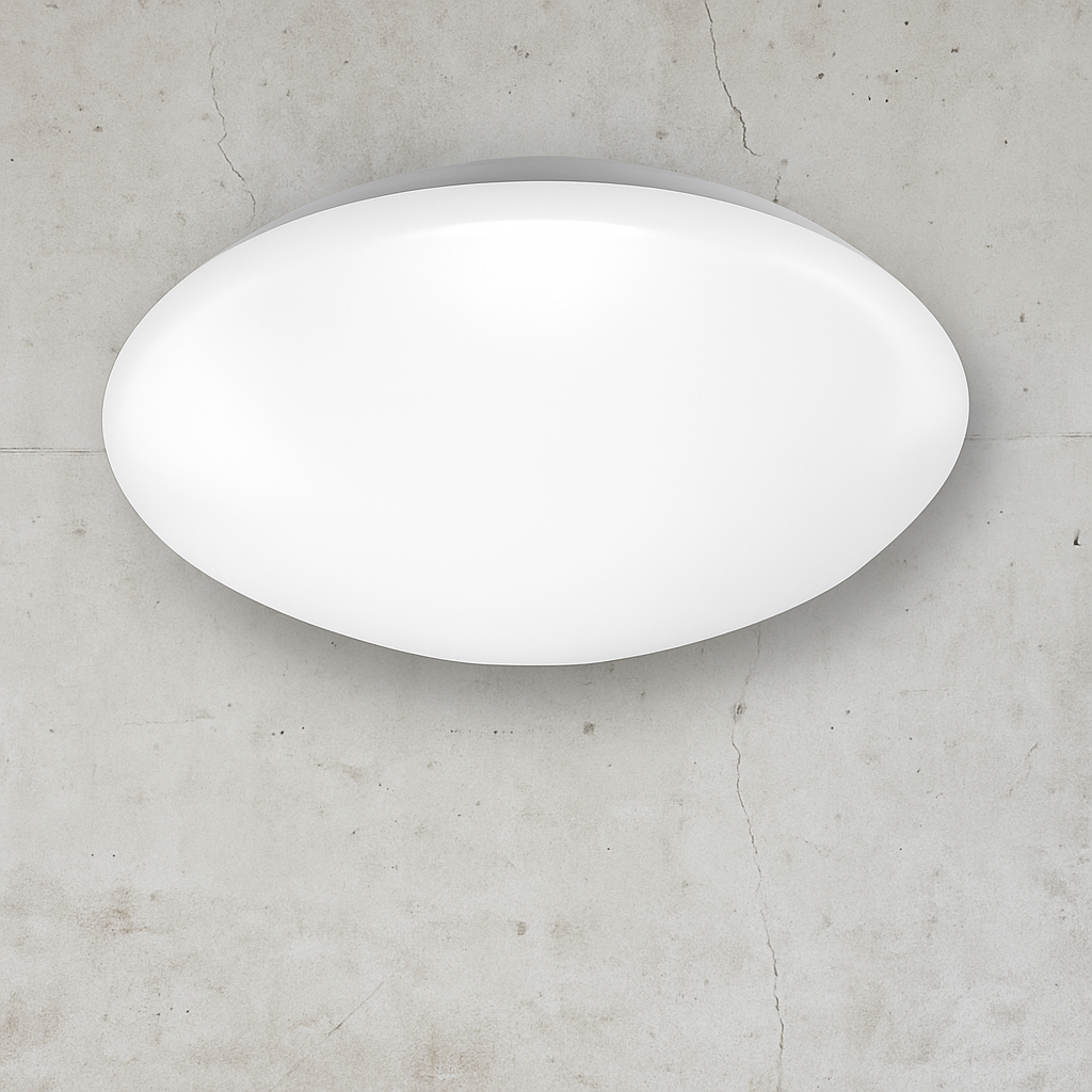 White oval light fixture on a gray concrete wall