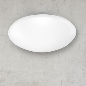 White oval light fixture on a gray concrete wall