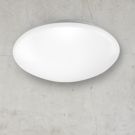 White oval light fixture on a gray concrete wall