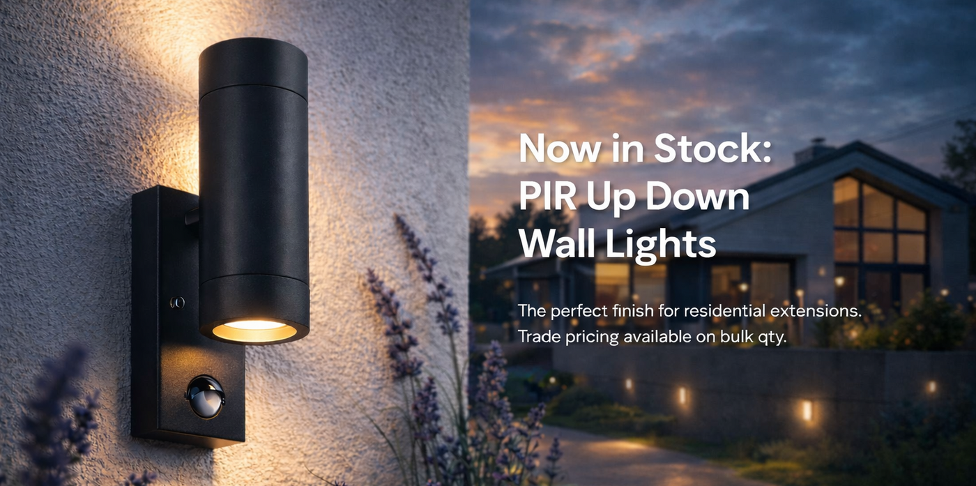 Black PIR up down wall light fixture on a textured wall with a scenic house background.